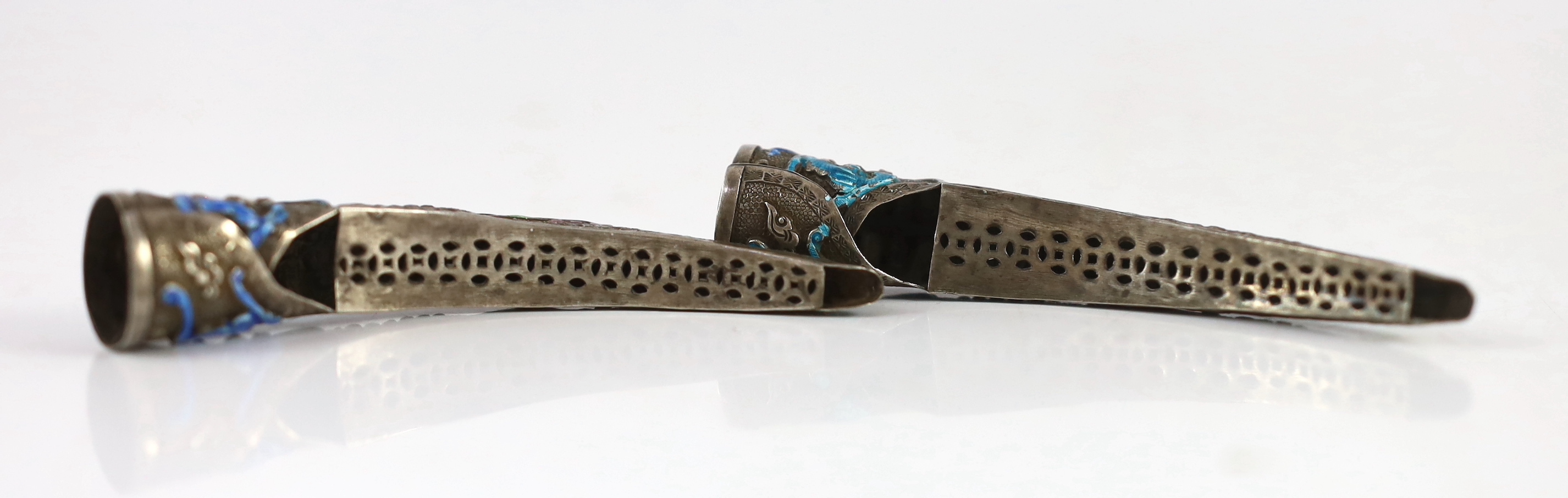 A pair of Chinese silver and enamel nail guards, late Qing dynasty, 8.5cm